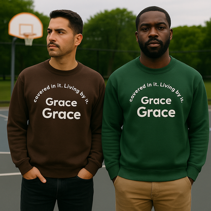 Two men wearing sweatshirts with 'Grace' text on a basketball court. Covered in it. Living by it. By Bright Colored Wings Clothing Brand