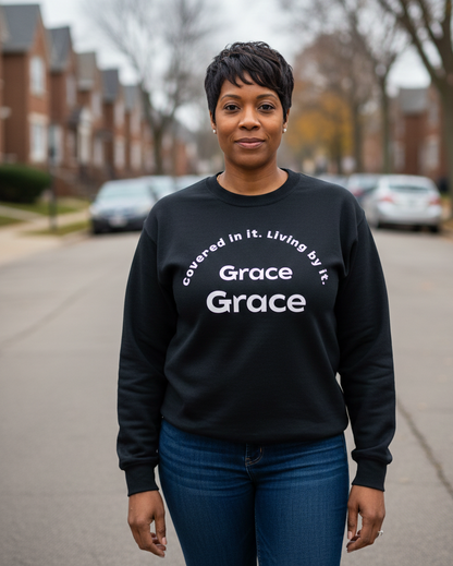 Covered in it. Living by it. Sweatshirt (Unisex)